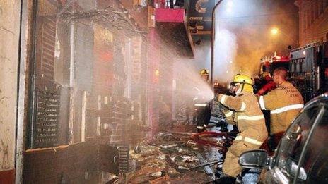 Firefighters try to put out a fire at the Kiss club in Santa Maria, Rio Grande do Sul, southern Brazil