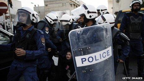 A protestor is arrested by riot policemen during a demonstration 18 January 2013