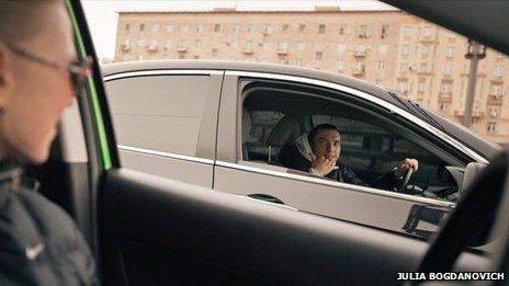 Alexander Erokhiny and his wife in cars, photo by Julia Bogdanovich