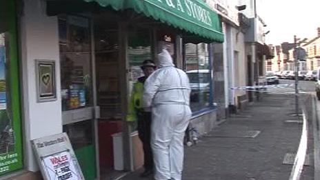 Police at the shop in Cathays