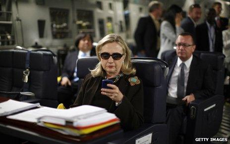 Clinton on her blackberry