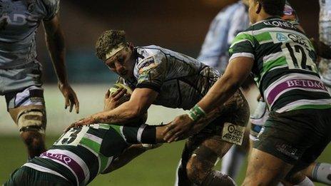 Cardiff Blues' Thomas Young is tackled by Jonathan Joseph