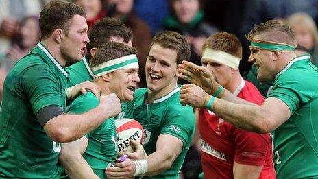 Brian O'Driscoll is congratulated by captain Jamie Heaslip plus team-mates Donnacha Ryan and Craig Gilroy after scoring Ireland's third try in Cardiff