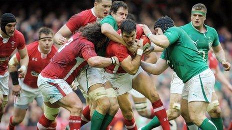 Wales scrum-half Mike Phillips is tackled during the Six Nations rugby match against Ireland at the Millennium Stadium