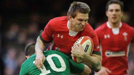 Dan Biggar is tackled by Ireland's Jonathan Sexton