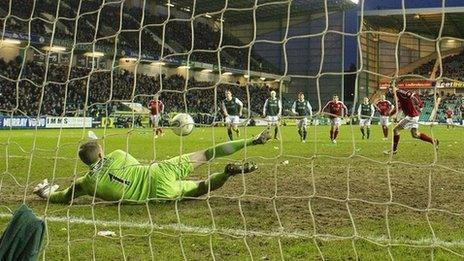 Hibernian goalkeeper Ben Williams saves Scott Vernon's penalty for Aberdeen