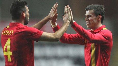 Joe Ledley and Gareth Bale celebrate a Wales goal against Austria