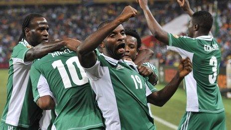 Nigeria's Sunday Mba (centre) celebrates after scoring against Burkina Faso