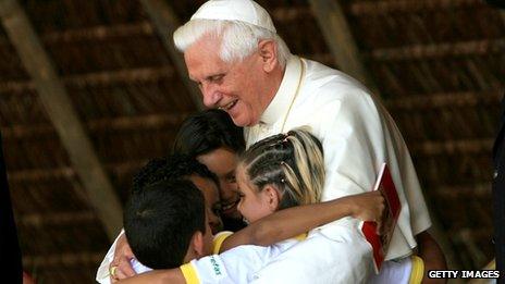 Pope Benedict embraces children during a visit to home for recovering drug addicts in Brazil, 12 May 2007