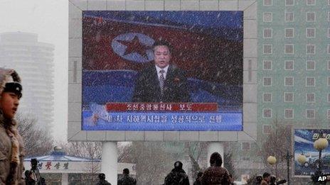 On a large television screen in front of Pyongyang's railway station, a North Korean state television broadcaster announces the news that North Korea conducted a nuclear test on Tuesday