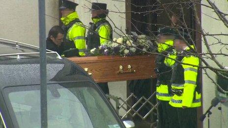 Constable Reynolds' coffin is carried into the church