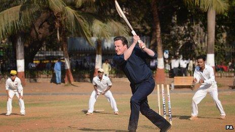 David Cameron playing cricket during his trip to India