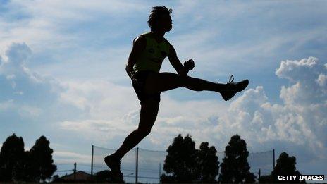 Player kicks a ball at an Essesdon bombers training session on 14 February 2013