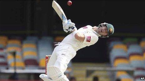 Australia's Michael Clarke reacts to a bouncer on the fourth day of the first cricket test match between Australia and South Africa, at the Gabba stadium in Brisbane, Australia