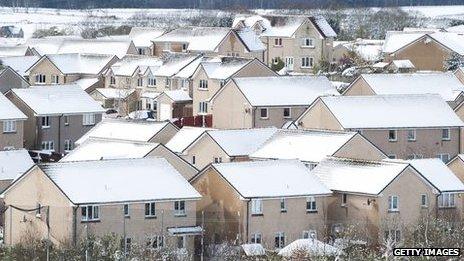 Homes covered in snow