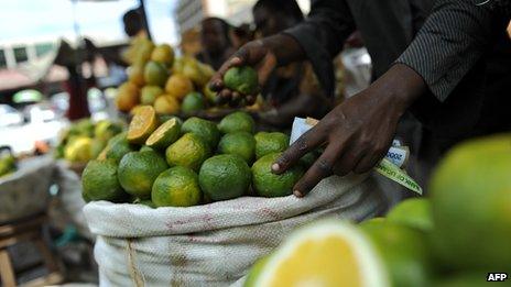 (File photo 2011) A stall holder sells fruit in Nakasero Market, Kampala