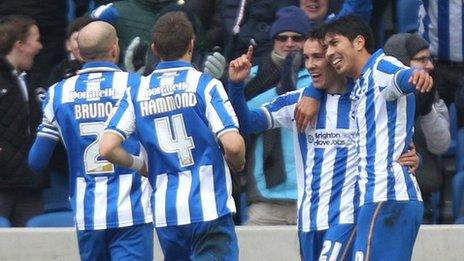 Leonardo Ulloa (r) and David Lopez (second r) celebrate Lopez's goal