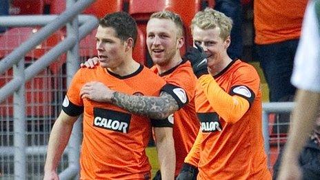 Johnny Russell and Gary Mackay-Steven congratulate United scorer John Rankin