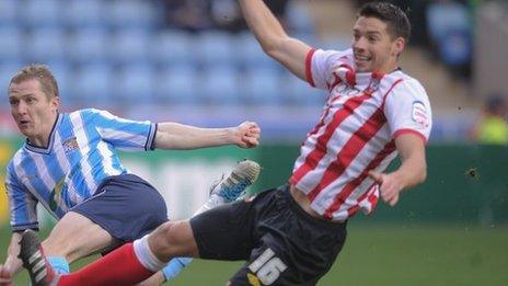 Aaron Martin challenges Gary McSheffrey in Coventry's FA Cup third round tie against Southampton, Jan 2012