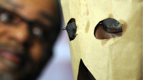 A gay Ugandan man hides his face with a makeshift hood in Washington, DC, on 2 February 2010