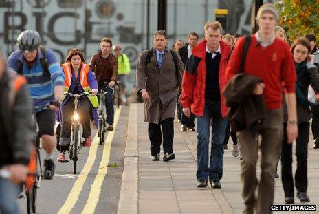 Commuters head to work on bikes and on foot