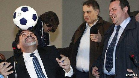 Diego Maradona balances a ball on his head during news conference in Naples. 26 Feb 2013