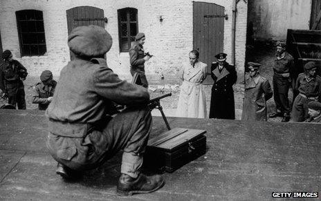 German General Alfred Jodl, Albert Speer and Karl Doenitz come out of their HQ after their arrest