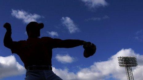 Jason Varitek of the Boston Red Sox warms up before the game against the New York Yankees in 2006