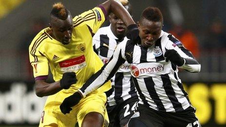 Anzhi Makhachkala"s Lacina Traore (L) with Newcastle United"s Mapou Yanga-Mbiwa