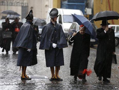 Cardinals pass Swiss Guards at the Vatican, 8 March