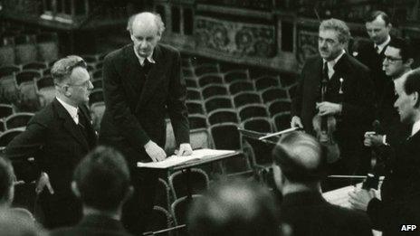 Governor of Austria Arthur Seyss-Inquart (left) standing by German conductor Wilhelm Furtwaengler and musicians, in 1938 in Vienna