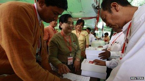 Delegates line up to get party congress books at the National League for Democracy congress in Rangoon, 10 March 2013