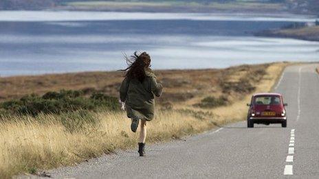 Girl running to car