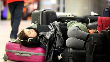 Woman sleeping in airport