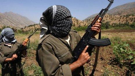 A picture taken in June 2007 of PKK fighters patrolling an area in the Iraqi part of the Qandil mountains near their headquarters on the Iraqi-Iranian-Turkish borders