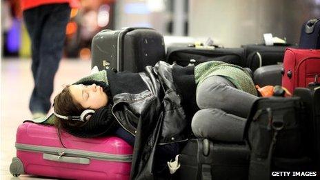 Woman sleeping in airport