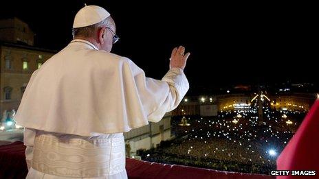 Pope Francis I greets the crowds from the balcony of St Peter's Basilica