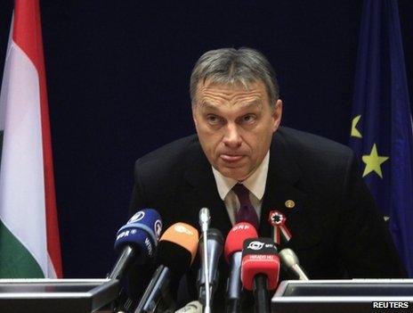 Prime Minister Viktor Orban of Hungary listens to reporters' questions in Brussels, 14 March