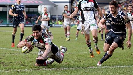 Centre Tom Casson of Harlequins dives over to score a try during the LV= Cup final against Sale Sharks