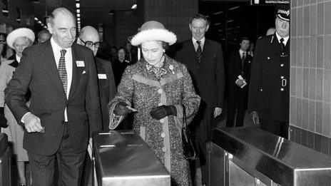 The Queen passing through a ticket barrier in 1977