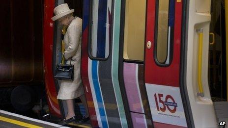 The Queen getting off a Tube train