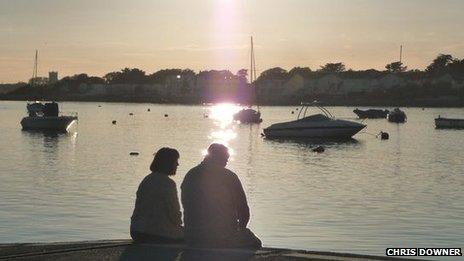 Couple overlooking Christchurch harbour (C) Chris Downer