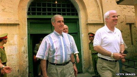 Pete Peterson and fellow Vietnam veteran John McCain leaving the Hanoi central prison