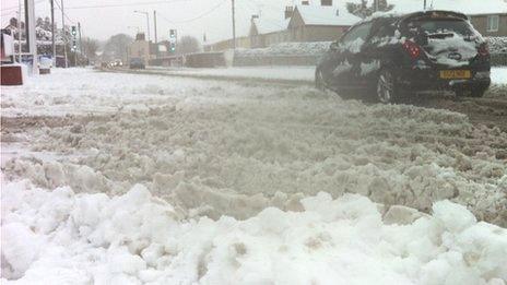 Heavy snow causes road disruption in Mold, Flintshire