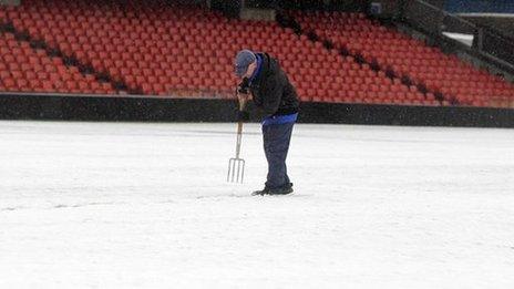 A groundsman working at Windsor Park on Friday