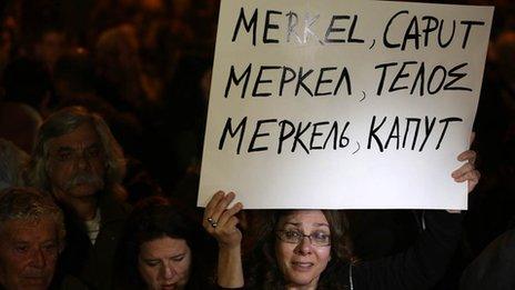 Cypriot bank worker with placard