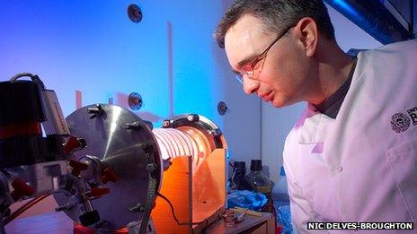 Dr Toby Jenkins using equipment to coat the dressing with nanocapsules