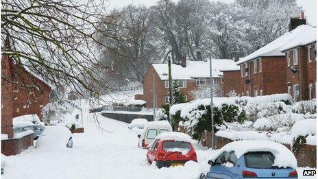 Cars buried knee deep in Mold in Flintshire over the weekend