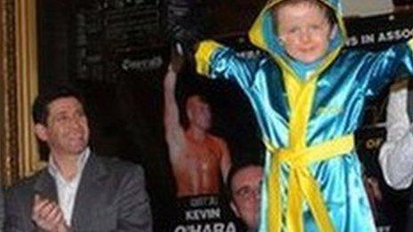 Oscar Knox in boxing robes