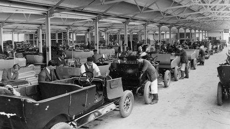 Staff working on a row of cars